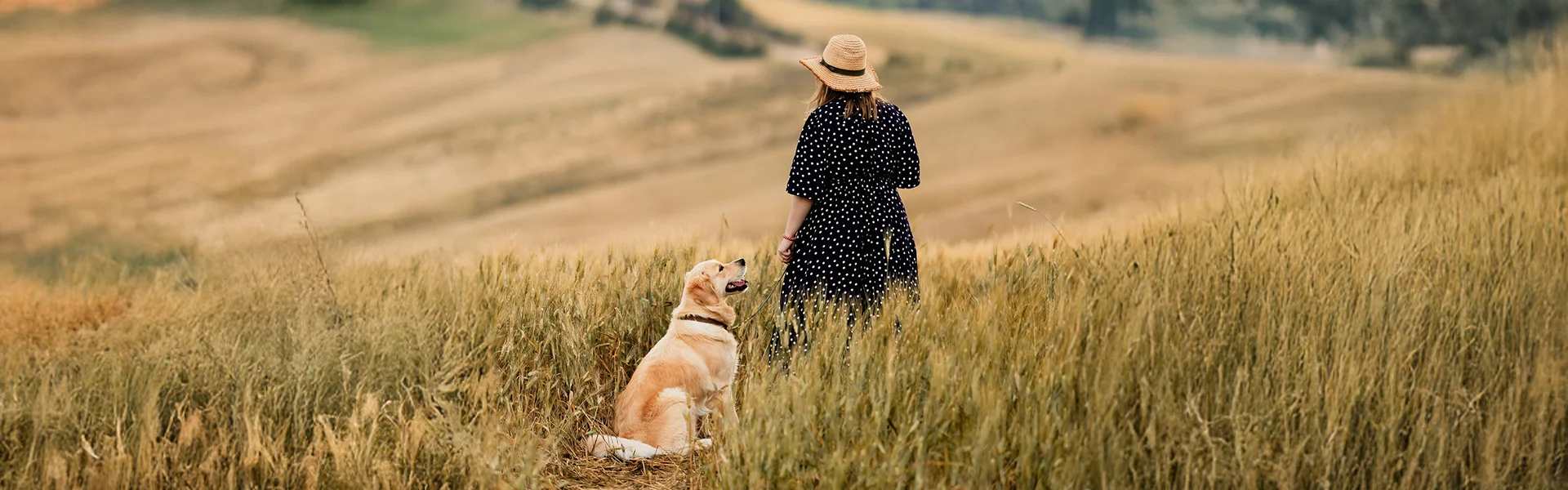 Woman with dog in a field